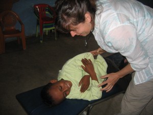 Dr. Christie adjusts the children